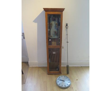 An oak cased Gent master clock with a magenta wall clock