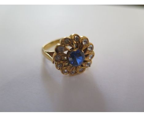 A gilt metal cluster ring, size N, approx 8.8 grams, surface tests to approx 18ct, good condition 