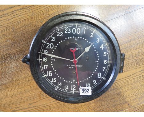 A US Government military bakelite bulkhead clock by Chelsea Clock Co Boston with 8 1/2" black dial, good condition, running 