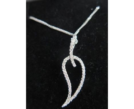 A contemporary 18ct white gold chain and pendant designed as an open leaf, chain length approx 44cms, pendant approx 30mm inc