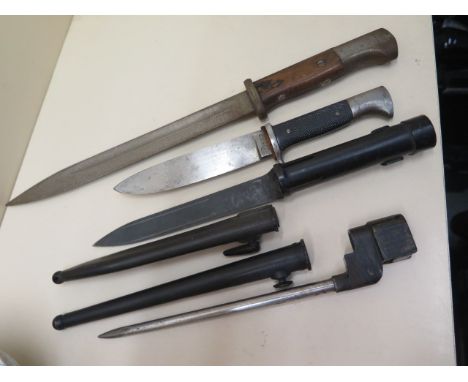 A German RZM M7/5 dagger blade, 14cm long, total 25cm, no scabbard, a spike bayonet and another both scabbards and a CVL 43cm