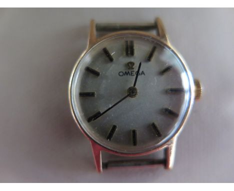 A 9ct yellow gold Omega manual wind ladies watch head 18mm case, approx 6.6 grams, running, good condition with box
