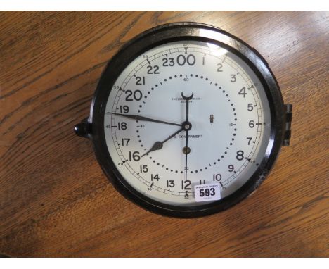 A US Government military bakelite bulkhead clock by Chelsea Clock Co Boston with 8 1/2" white dial, good condition, running 