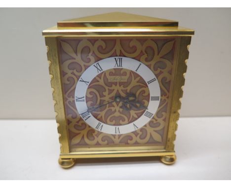 A gilt brass Saint Blaise mantle clock - Height 12cm - working order 