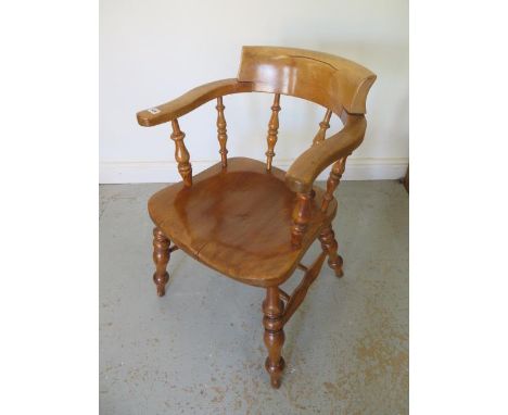 A Victorian smokers bow armchair, 77cm tall x 53cm wide, good light colour and patina 