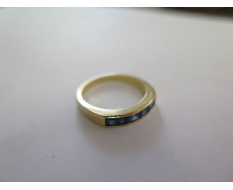 A gilt metal ring, size O, approx 4 grams, surface tests to approx 18ct, some small usage marks, otherwise good 