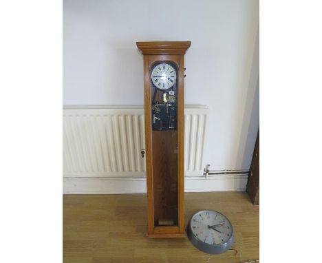 A 20th century oak cased synchronome electric master clock, 130cm, with a Gent slave wall clock 35cm diameter 