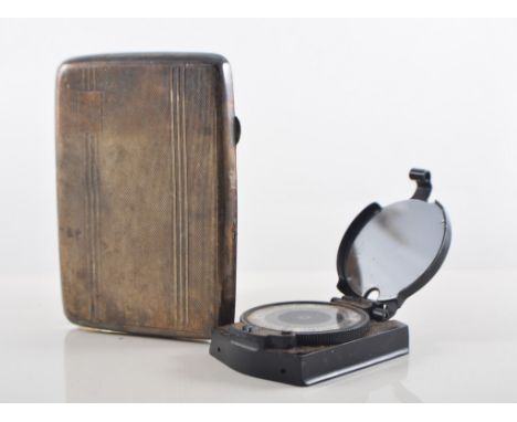 Bakelite marching compass, 7cm and a silver cigarette case, Birmingham 1940, engine turned decoration, (2).