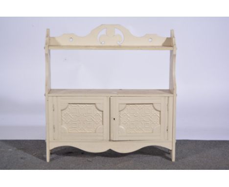 Edwardian painted wall cabinet, with an open shelf over two doors, press moulded panels, width 57cm.