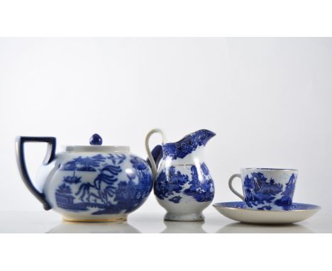 Doulton "Willow" pattern teapot and a quantity of un-named Willow pattern teaware, consisting of eleven saucers plus one odd,