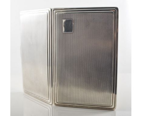 Silver cigarette case, engine turned design with a plain polished stepped border, vacant initial plate, gilded inside and hav
