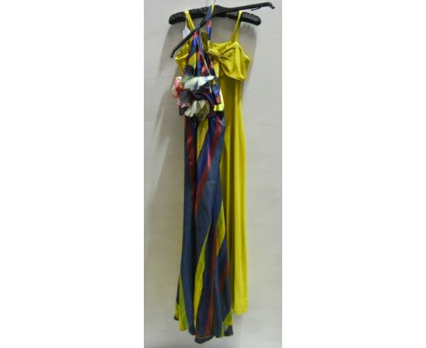 Two vintage evening gowns, a yellow fitted crepe dress with diamanté bow to top and narrow straps, a navy, yellow and red dia