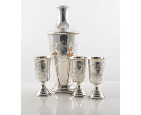 White metal liquor set with decanter, 20cm, and six small goblets with gilded bowls, 7cm, all having an etched scene on body,
