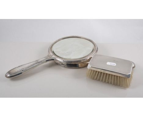 Silver mounted hand mirror, engine turned decoration with an engraved border, two other hand mirrors and seven other dressing