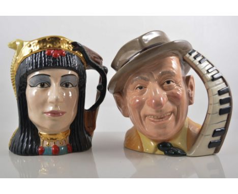 Four large Royal Doulton character jugs, Charlie Chaplin, Jimmy Durante, Anthony and Cleopatra and Anne Boleyn together with 