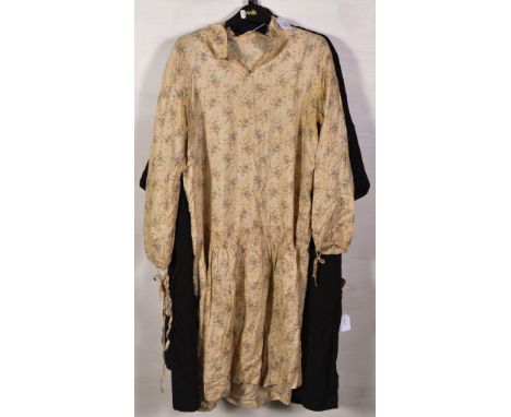 Three vintage garments, a cream silk floral patterned dress with drop waist, a navy crepe open fronted coat with navy braid t