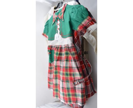 Three girls dresses, two cotton check and one navy and white spot, and a girls blouse.
