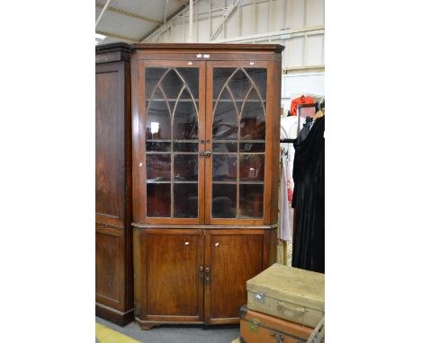 Victorian mahogany freestanding corner cabinet, cavetto moulded cornice, lancet glazed doors enclosing three fixed shelves, c