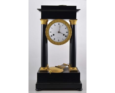 Ebonised French portico clock, dial signed Hunziker, No. 22, Rue de Bussy, gilt metal mounts with winding key and pendulum.