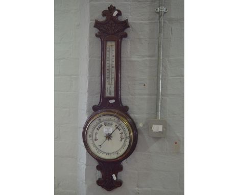 Victorian dark carved oak banjo barometer, with porcelain dials.