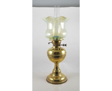 Brass oil lamp with Vaseline glass tinted shade complete with chimney, 57cm.