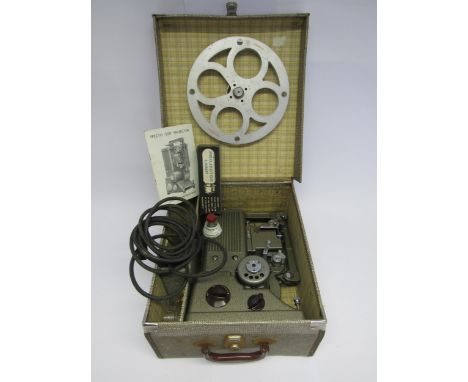 A Specto 500 cine projector in original case with manual and boxed lamp 