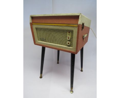 A mid 20th Century Dansette Bermuda record player with Monarch turntable, raised on round tapering legs, lid detached (a/f) 