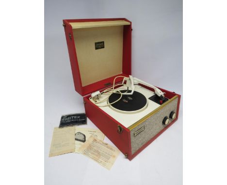 A mid 20th Century Dansette Tempo record player with Garrard turntable, mechanism restored in 2021, with some original paperw