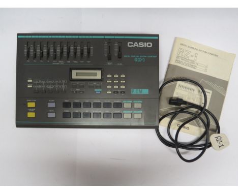 A Casio RZ-1 digital sampling rhythm composer drum machine with manual and power lead 
