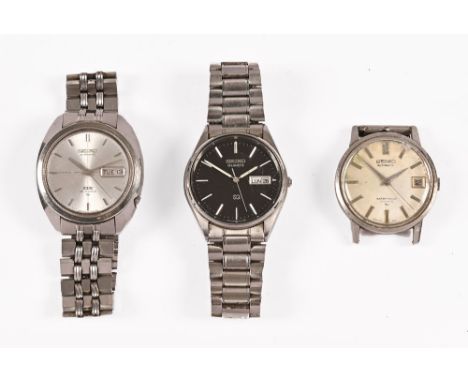 Three vintage Seiko gentleman's stainless steel wristwatches, and a Swatch quartz watch.