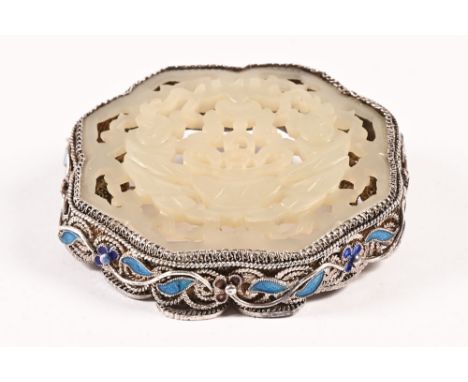 A Chinese silver brooch, with pierced and carved jade centre.  Width 46 mm (see illustration).