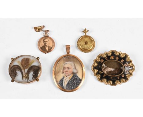 A 19th century oval portrait miniature on ivory, of a gentleman wearing a blue coat, together with a small 9 ct gold double s