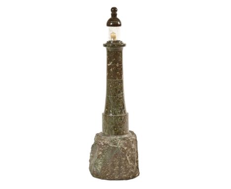 A Cornish serpentine lighthouse lamp.  Height 57 cm, the base +/- 15 x 16 cm (see illustration).