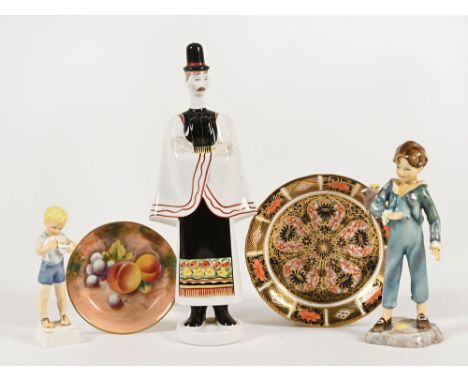 A Royal Worcester figure "The Parakeet" by Doughty, a Royal Worcester fruit painted pin dish, a Derby saucer, a Hungarian fig