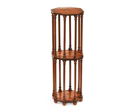 A 19th century inlaid satinwood octagonal three tier stand, with turned and ebony strung spindle supports and raised on short