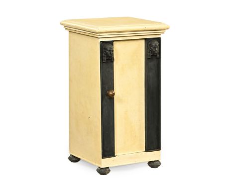 A 19th century painted metal campaign washstand, with moulded edge and top hinging to a basin.  The door with Egyptian style 