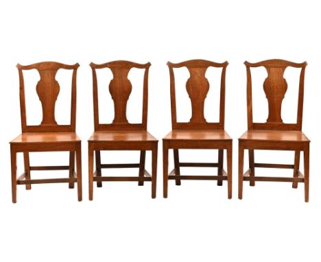 A set of four 19th century Chippendale style dining chairs, with splat back solid seat and tapered legs of square section.