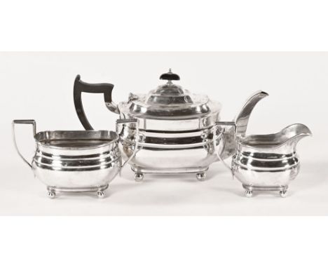 A William Hutton & Sons Ltd three piece silver tea service, Sheffield date letter T 1936, weight 1110 grams (see illustration
