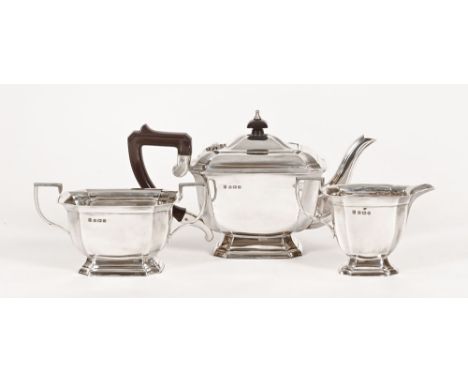 A Northern Goldsmiths three piece silver tea service, Birmingham 1913, weight 944 grams (see illustration).