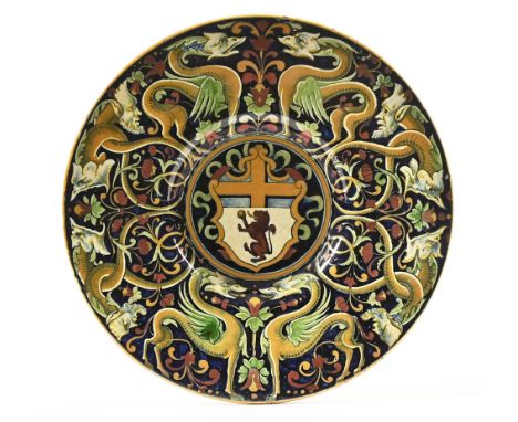 A Cantagalli Heraldic Majolica charger, decorated with mythical beasts and coat of arms to the centre.  Diameter 30.5 cm, the