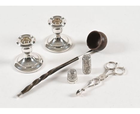 An engraved silver perfume holder, Birmingham 1882, a small pair of silver candlesticks Birmingham 1968, a pair of silver sci