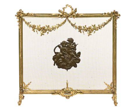 A French ormolu fire screen, with cherubs to centre and with ribbon carrying handle.  Height 75 cm, width 80 cm.