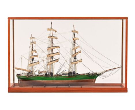 A scale model of a three masted sailing vessel, housed in a glazed display case.  Case height 61 cm, length 95 cm, depth 27 c