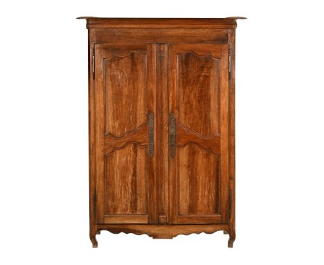A French walnut armoire, with a pair of panelled doors and internal shelf with single small drawer.  Height 208 cm, width 152