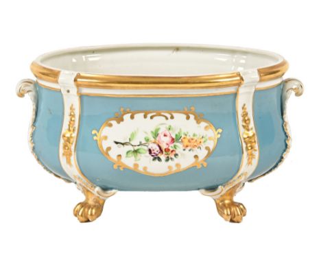 A Portuguese blue ground oval vase or planter, raised on paw feet and with hand painted panels.  Height 14 cm, length 27.5 cm