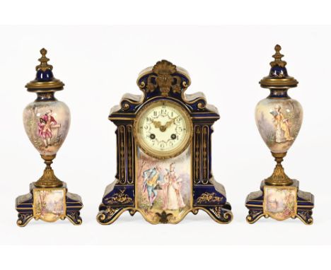 An early 20th century clock garniture, with ceramic case decorated in blue and gilt and with panel depicting a courting coupl
