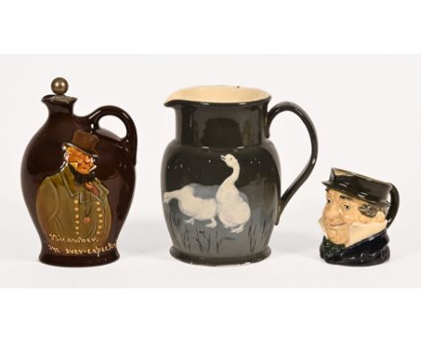 A Dewars Whisky Royal Doulton Micawber, Charles Dickens whisky flask.  Height 19 cm, together with a Royal Doulton jug decora