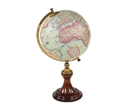 A 20th century globe, raised on a brass and mahogany stand.  Height +/- 62 cm.