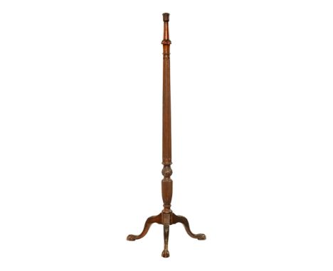 An early 20th century mahogany torchere standard lamp base, with reeded column and trefoil splay legs with animalistic feet. 