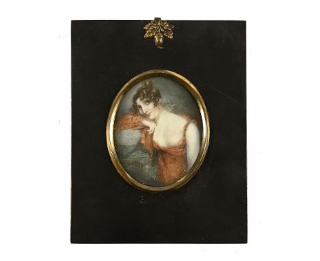A 19th century portrait miniature on ivory, of a lady in orange dress.  8 cm x 6.5 cm in ebonised frame with acorn hanger.  N